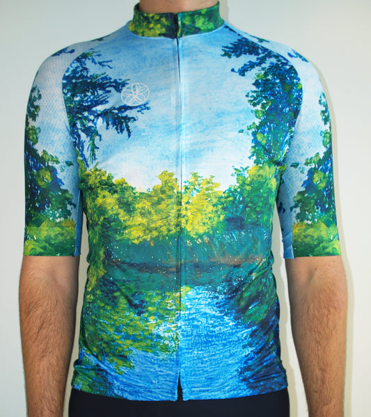 Cycling jersey with nature-themed design on a plain background