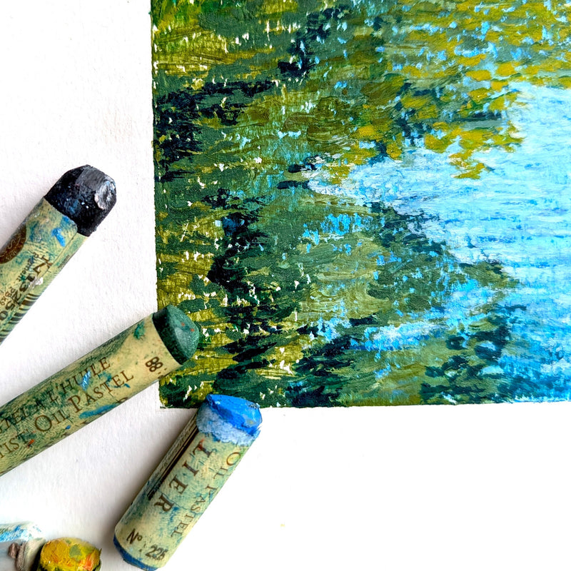 Artistic crayon strokes on paper with crayons scattered around. Close up of the design of the Canal Daydream cycling jersey.